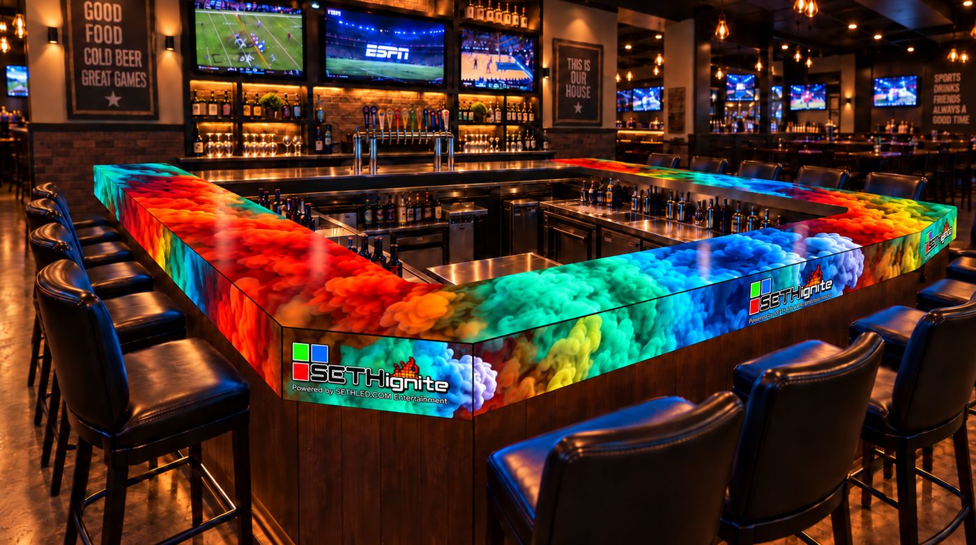 The bar, its whole top a lit LED surface showing ink swirling through water.